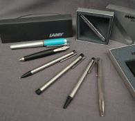 Two Lamy fountain pens together with two Lamy ballpoint pens,