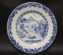 A Chinese porcelain blue and white plate, decorated with a landscape scene to the centre, 23.