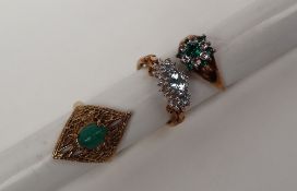 A 9ct gold ring set with a green cabochon stone,