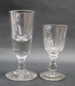 A 19th century wine glass with a tapering deceptive bowl on a waisted column and spreading foot, 13.