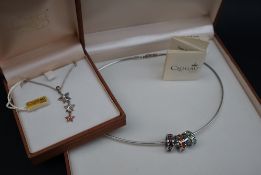 A Clogau silver three star pendant, paste set, to a silver chain,