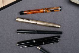 A Conklin Duragraph Amber Fountain pen, boxed together with a Colibri gilt metal fountain pen,