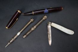 A Victorian silver bladed and mother of pearl folding knife together with a silver propelling