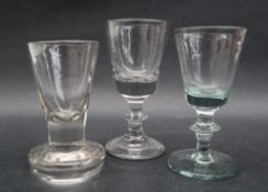 A 19th century toast masters glass with a tapering bowl and integral column on a thick spreading