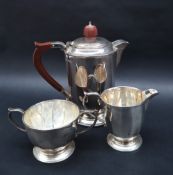 An Elizabeth II silver three piece teaset with a panelled body on a spreading foot, Sheffield, 1961,