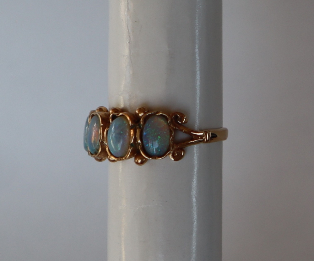 A 9ct gold ring set with four oval moonstones, size M, approximately 2. - Image 2 of 5