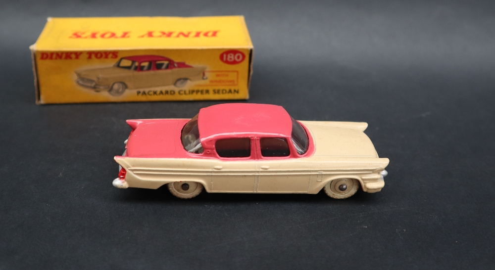 A Dinky Toys 180 Packard Clipper Sedan with windows having a cerise upper body, - Image 5 of 5