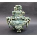A Chinese hardstone twin handled vase and cover, carved with dragon heads, 20cm high,