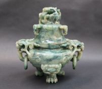 A Chinese hardstone twin handled vase and cover, carved with dragon heads, 20cm high,