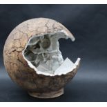 Studio Pottery - An orb with an opening with a glazed geometric and wave interior,