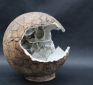 Studio Pottery - An orb with an opening with a glazed geometric and wave interior,