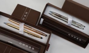 Two Cross sterling silver ballpoint pens together with two Cross gold plated ballpoint pens