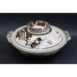 Attributed to Michael Cardew, a tureen and cover with scrolling decoration and twin handles,