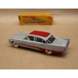 A Dinky Toys 192 De Soto Fireflite Sedan in grey with red roof and flash,