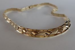 A 14ct yellow gold necklet, with tapering two tone links, approximately 28.