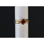 An 18ct yellow gold ring set with an oval faceted ruby, size M 1/2, approximately 2.