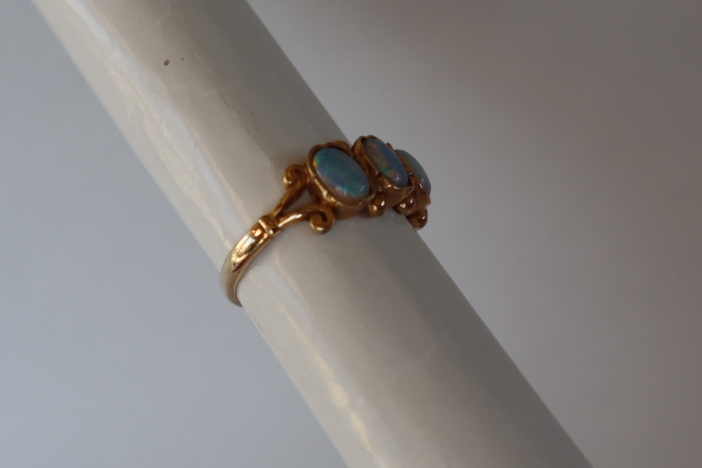 A 9ct gold ring set with four oval moonstones, size M, approximately 2. - Image 3 of 5