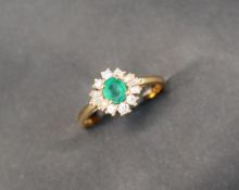 An emerald and diamond ring,