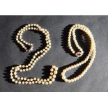 A pearl necklace set with graduated pearls to a 9ct gold garnet and pearl clasp,