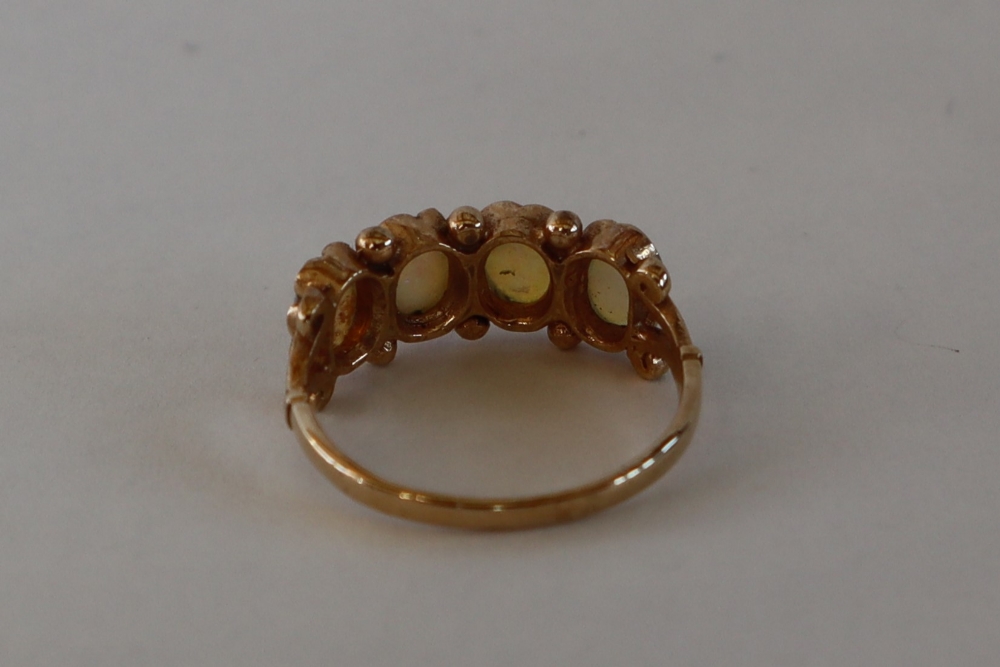 A 9ct gold ring set with four oval moonstones, size M, approximately 2. - Image 4 of 5