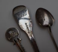 A pair of Edward VII silver fiddle shell and thread pattern table spoons, Sheffield 1902,