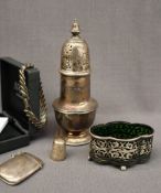 A George V silver sugar caster with a turned finial and domed top above a baluster body and