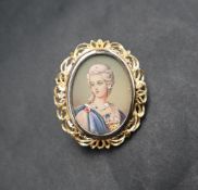 An 18ct gold portrait miniature pendant / brooch, depicting a lady wearing gem set jewellery,