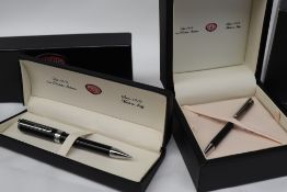 An Aurora silver ball point pen boxed together with another Aurora ballpoint pen,