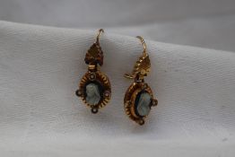 A pair of yellow metal cameo earrings set with profiles of Queen Victoria with four seed pearls,