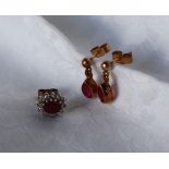 A pair of ruby drop earrings and a single ruby earring, approximately 2.