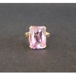 A 9ct gold amethyst set dress ring, with a raised rectangular faceted amethyst, size L,