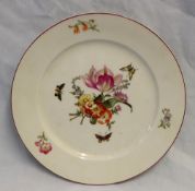 A Berlin porcelain plate with a cerise line rim decorated to the centre with a bouquet of flowers