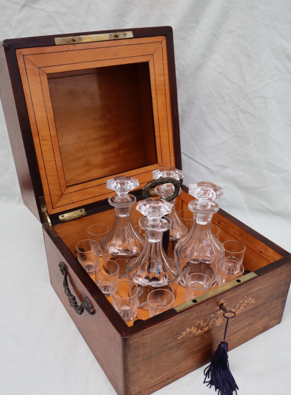 A Victorian rosewood liquer tantalus of square form,
