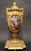 A Vienna style porcelain twin handled vase, the domed top with a flame finial,