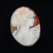 A shell cameo, carved with a maiden in profile,