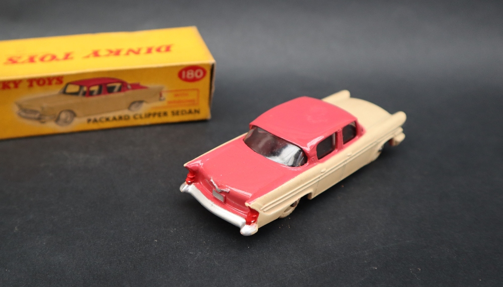 A Dinky Toys 180 Packard Clipper Sedan with windows having a cerise upper body, - Image 2 of 5