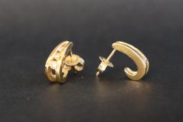 A pair of 18ct yellow gold earrings set with graduating round brilliant cut diamonds,