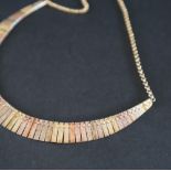 A 9ct tri coloured gold fringe necklace, approximately 14.