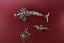 A silver and enamel RAF brooch together with a silver medallion and a white metal reticulated fish