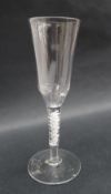 A 19th century wine glass with a tall tapering bowl and double helix cotton twist stem on a