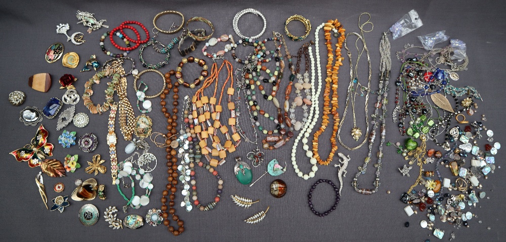 Assorted costume jewellery including brooches, pendants, necklaces,