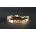 An 18ct yellow gold brick pattern diamond set bracelet,