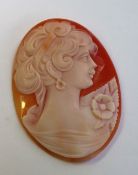 A shell cameo, carved with a maiden in profile,