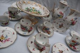 An Herend porcelain part tea service comprising a hot water pot, five tea cups,