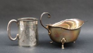 An Edward VII silver christening mug, of tapering cylindrical form, decorated with swags of flowers,