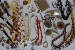 Assorted costume jewellery including faux pearls, beaded necklaces, Gucci wristwatch, brooches,