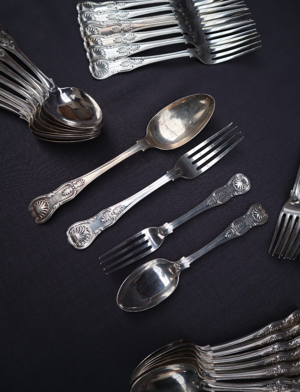 A Victorian kings pattern silver part flatware service comprising eight table spoons,