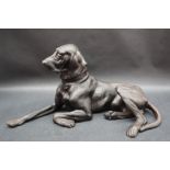 After Nikolai Ivanovich, a cast figure of a recumbent hound with foundry mark and dated 1963,