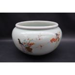 A Chinese porcelain bowl, with a Celadon green glaze painted with figures and a crane,