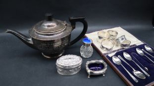 A George VI silver teapot with a domed cover and tapering body on a spreading foot, Birmingham,